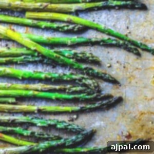 Crispy Roasted Asparagus 9 picture of roasted asparagus on a sheetpan
