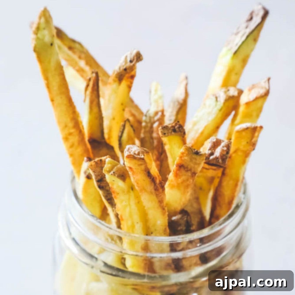 air fried french fries in a glass jar