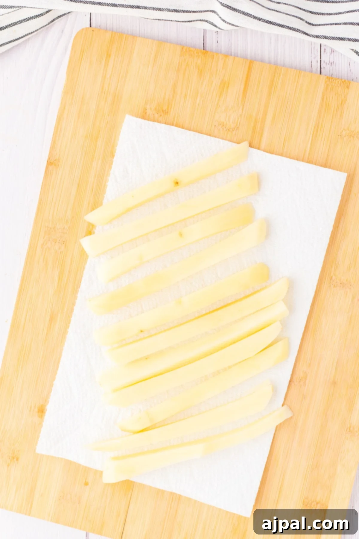 fries drying on a paper towel