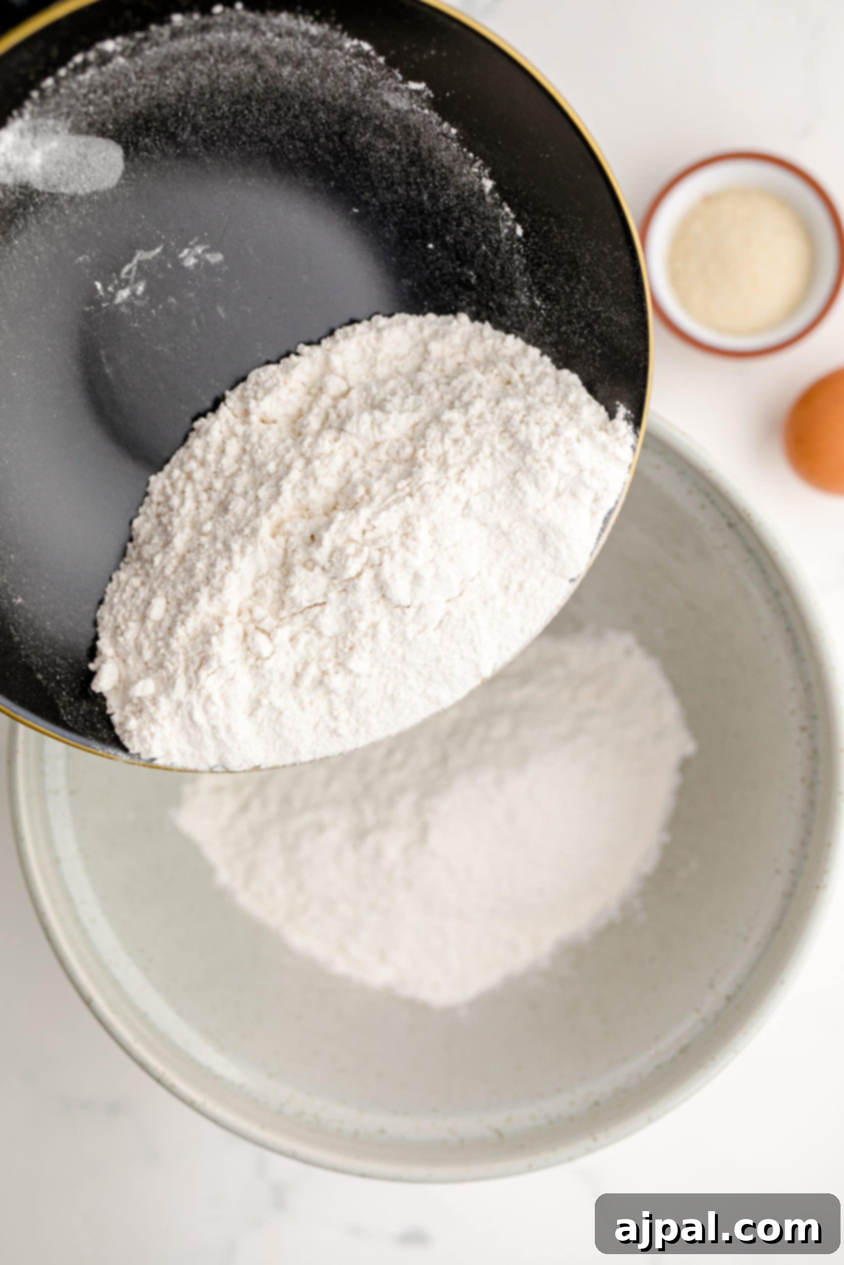 A bowl with flour and eggs, perfect for making a blueberry muffin recipe.