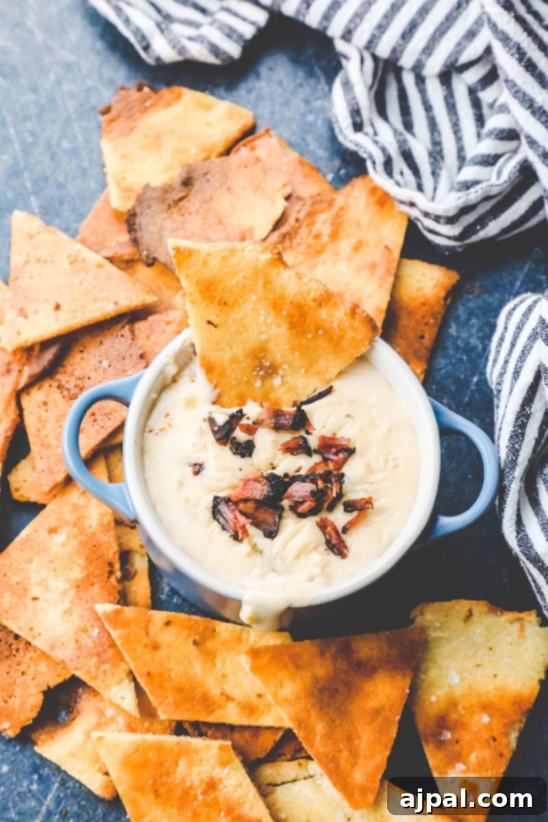 Quick Keto Tortilla Crisps 3 Picture of keto tortilla chips on a plate with dip, ready to be enjoyed.