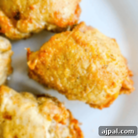 Crispy Adobo Air Fried Chicken Thighs 8 Adobo Chicken Thighs on a white plate.