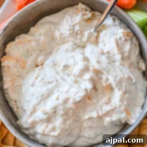 A bacon ranch dip with cheddar, served with carrots and celery.