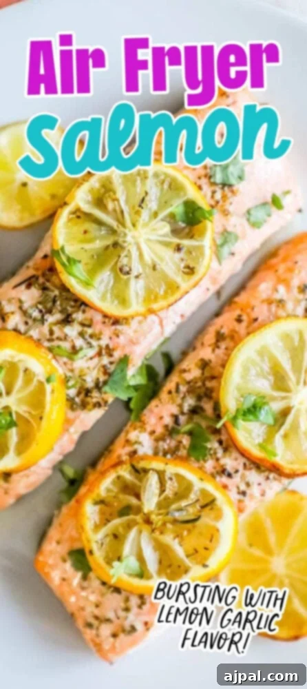 Easy Air Fryer Lemon Garlic Salmon 9 salmon filets with lemon slices, garlic and herbs on top on a white plate
