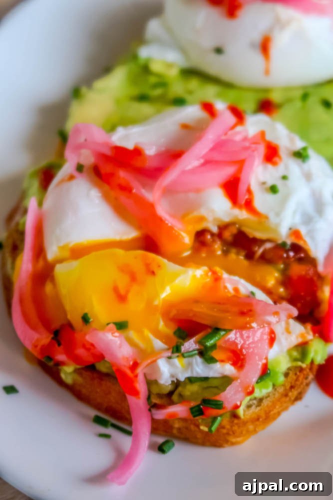 Idyllic Santa Ynez Valley Getaway 11 A close-up of a perfectly poached egg on a bed of creamy avocado toast with fresh arugula, a signature dish at Plenty on Bell.