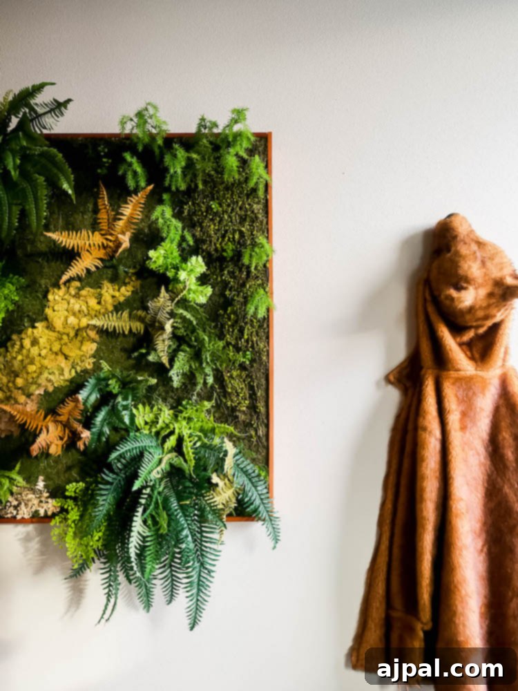 A vibrant moss wall adorned with a charming teddy bear, creating a whimsical and cozy touch to the decor at Calwise Spirits in Paso Robles.