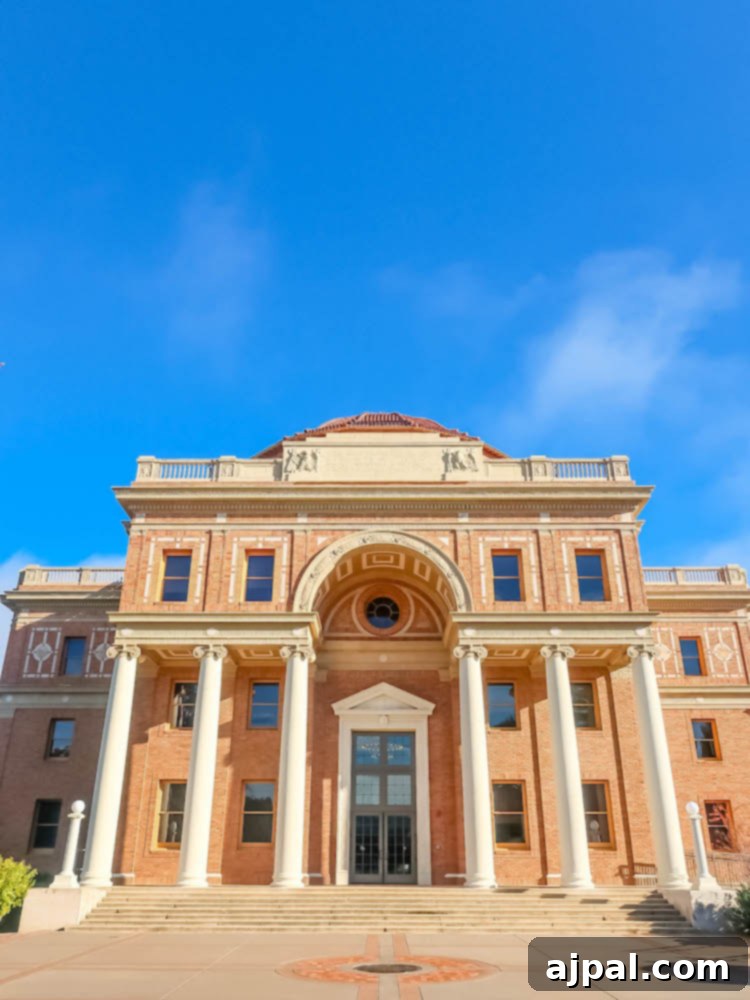A large building with columns and a blue sky in Paso Robles, highlighting beautiful architecture near Atascadero accommodations.