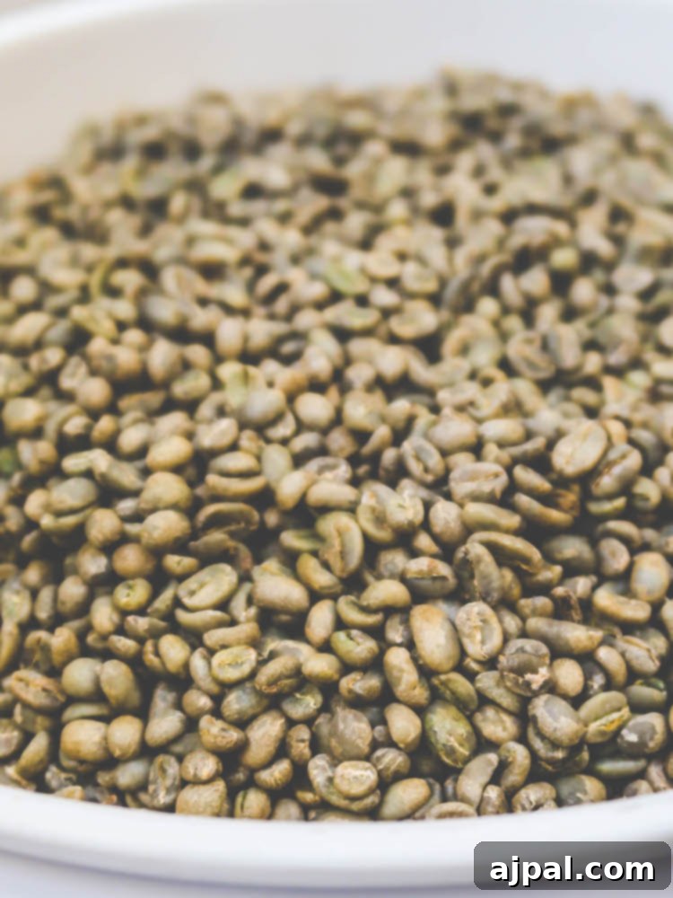 An aesthetic display of vibrant green coffee beans in a bowl on a wooden table, showcasing the fresh quality at JoeBella Coffee Roasters.