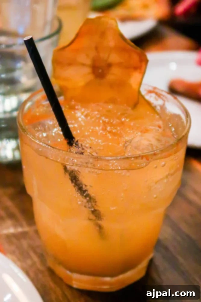 A refreshing margarita with a slice of orange on a table in Santa Monica, California.