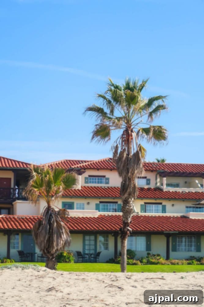 A beachfront hotel with palm trees in Oxnard, California.