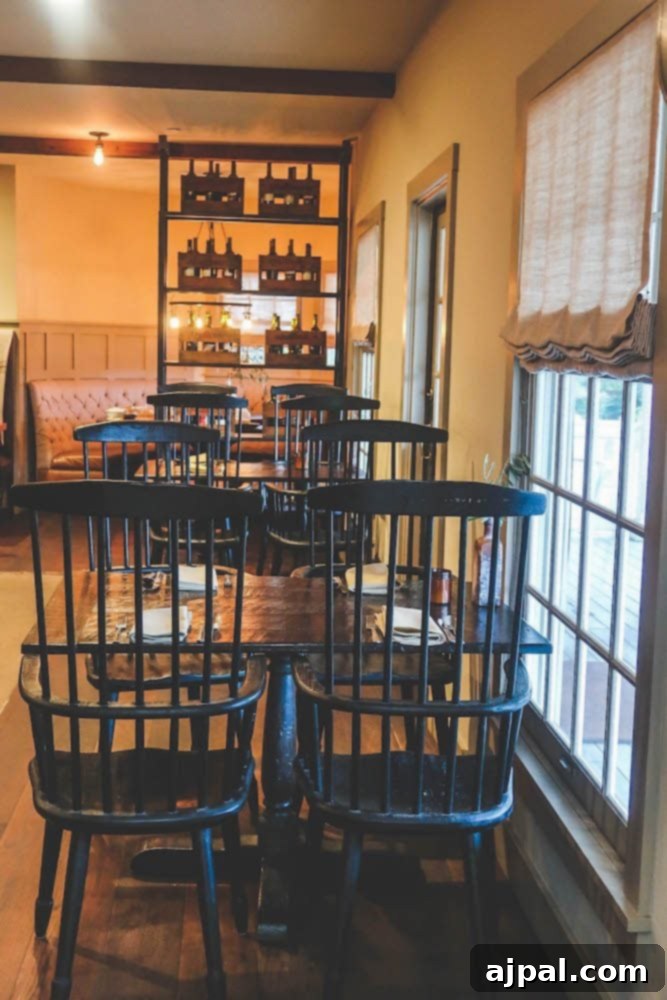 A winery in Santa Ynez Valley offering a dining room with a table and chairs.