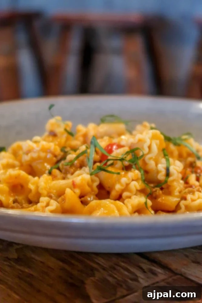 A plate of pasta on a wooden table at a winery in Sideways California.