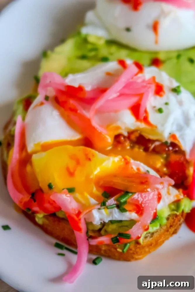 A plate of avocado toast with a poached egg and arugula, perfect for a day in the Santa Ynez Valley.