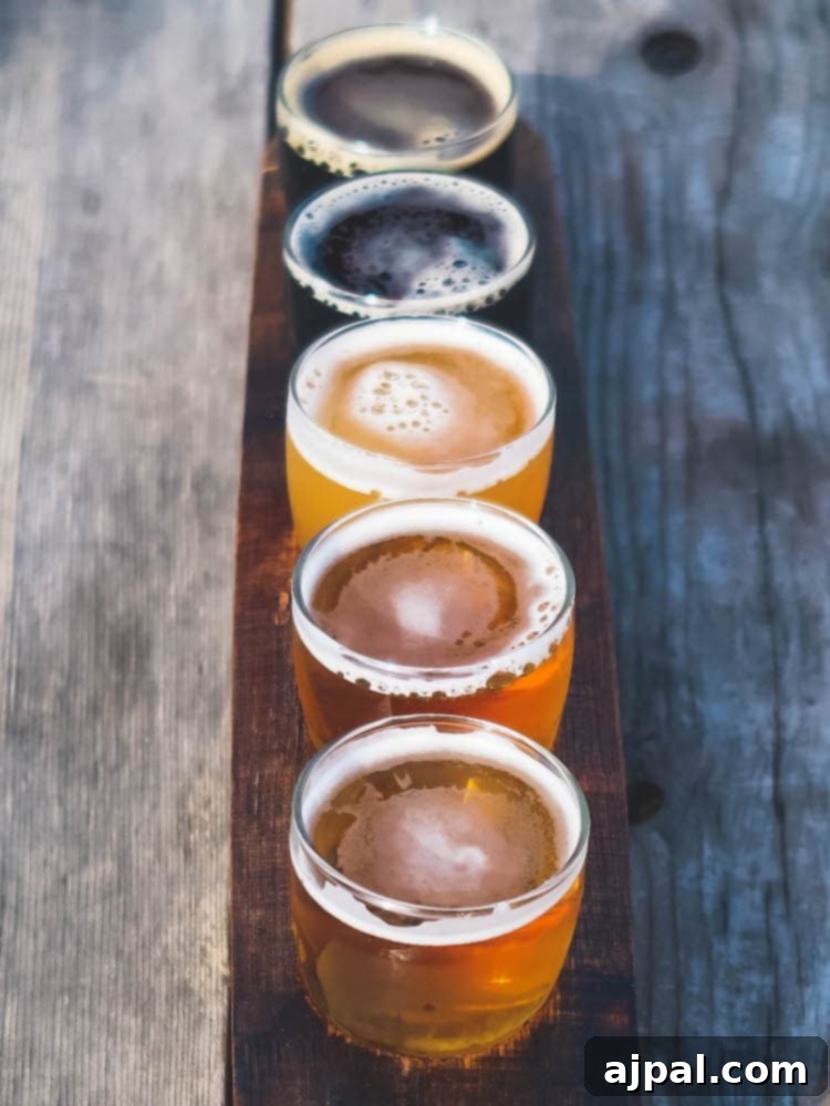 Five different beers are displayed on a wooden tray as part of A Perfect Day in SLOCal.
