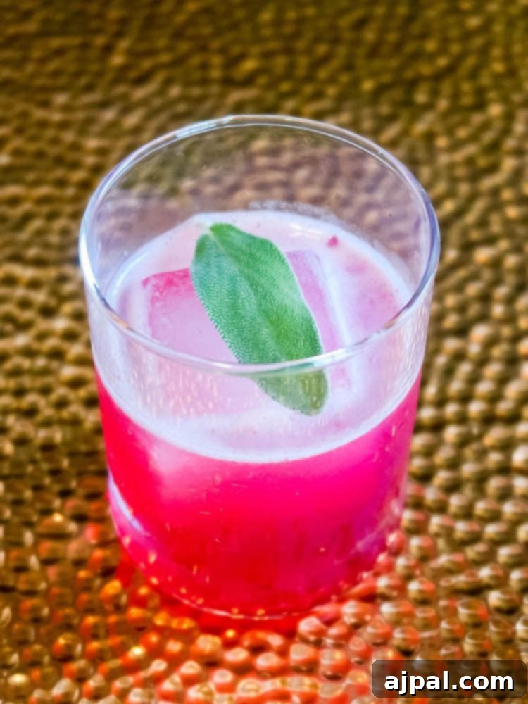 A pink drink with a sprig of sage on top to try in Atascatero.