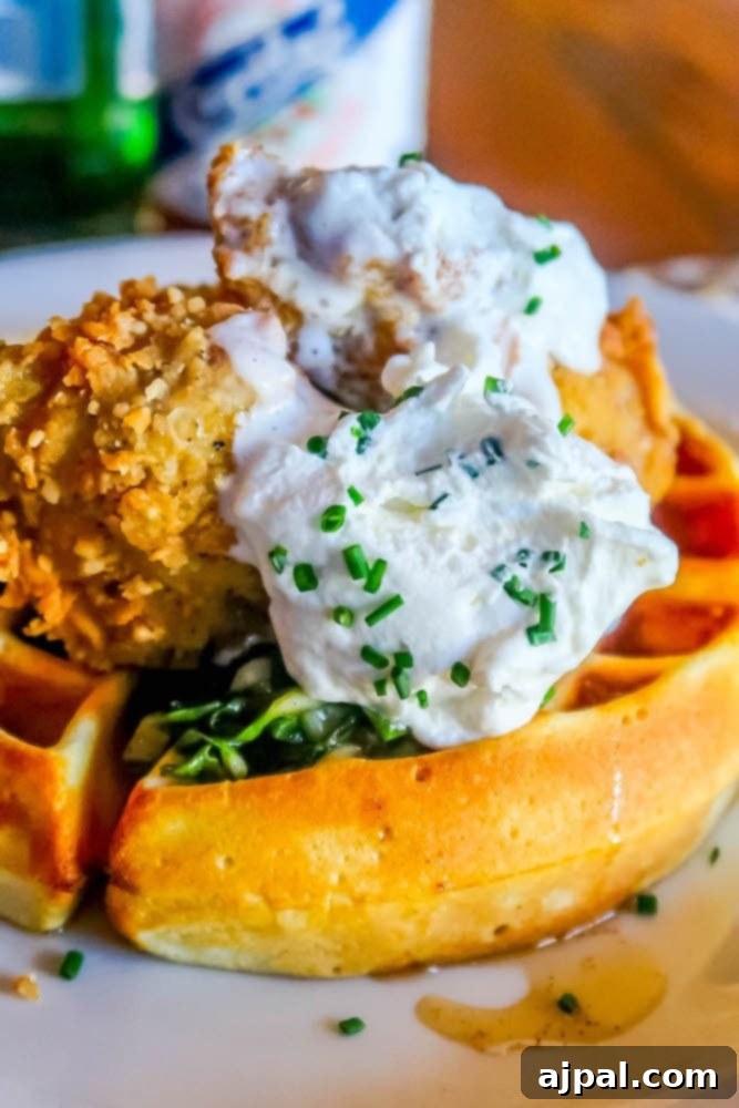 A Perfect Day in SLOCal with fried chicken and waffles served on a plate.