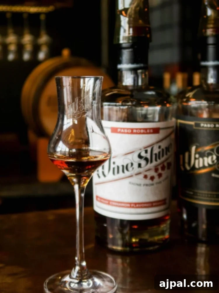 A glass of whiskey resting on a SLOCal bar.