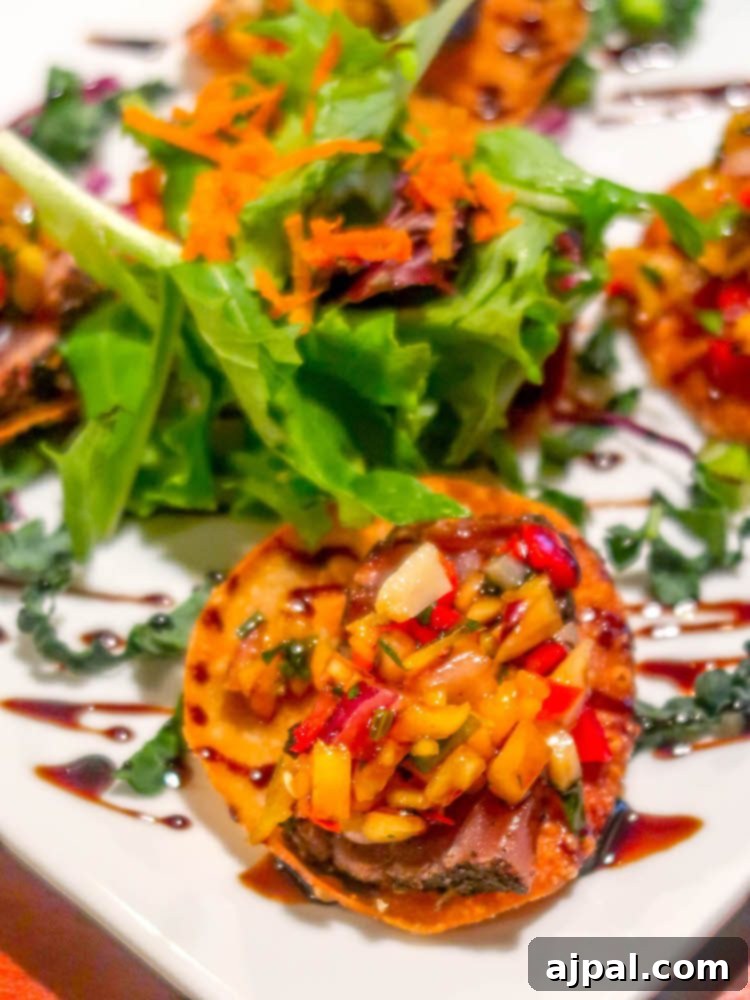 A plate of food with a salad on it, perfect for diners in Paso Robles.