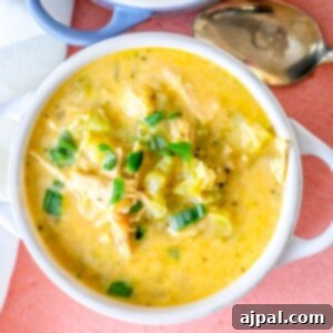 Picture of cheesy broccoli soup in a white bowl