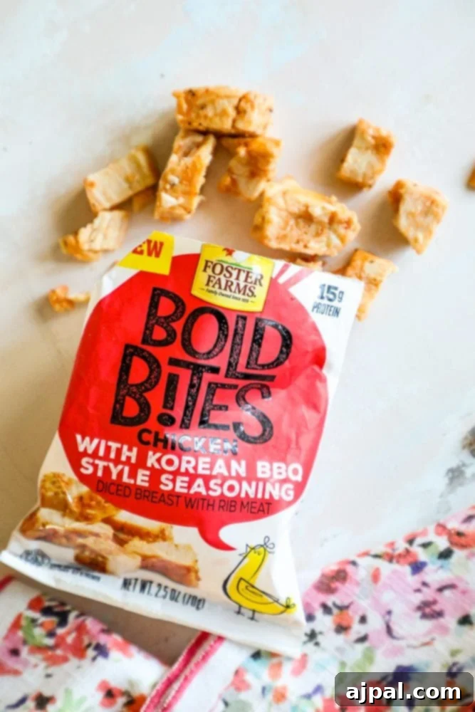 A hand holding a bag of Foster Farms Bold Bites, showcasing its portable and convenient packaging.