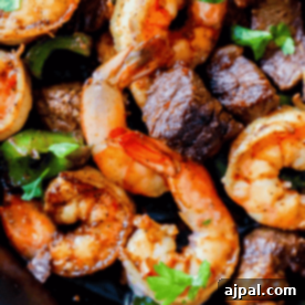 A plate of Cajun steak and shrimp.