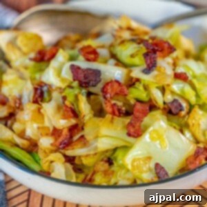 Cabbage and bacon in a white bowl