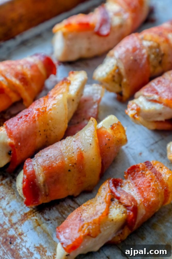 chicken wrapped in bacon in a pan
