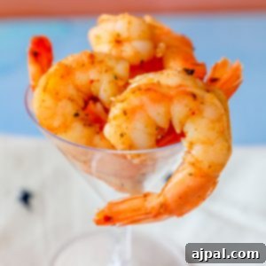 Cajun shrimp in a martini glass, seasoned to perfection and ready for a meal.