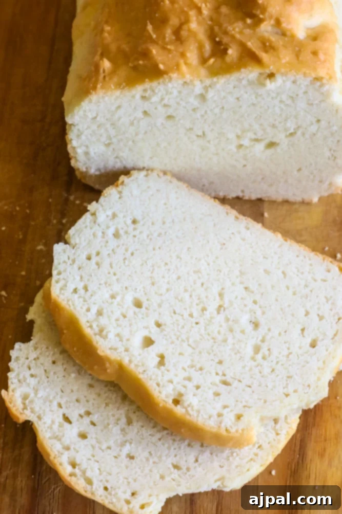 Effortless Keto Sandwich Loaf 2 Easy Low Carb Bread Recipe - A beautifully baked loaf of fluffy keto sandwich bread, sliced and ready to enjoy.