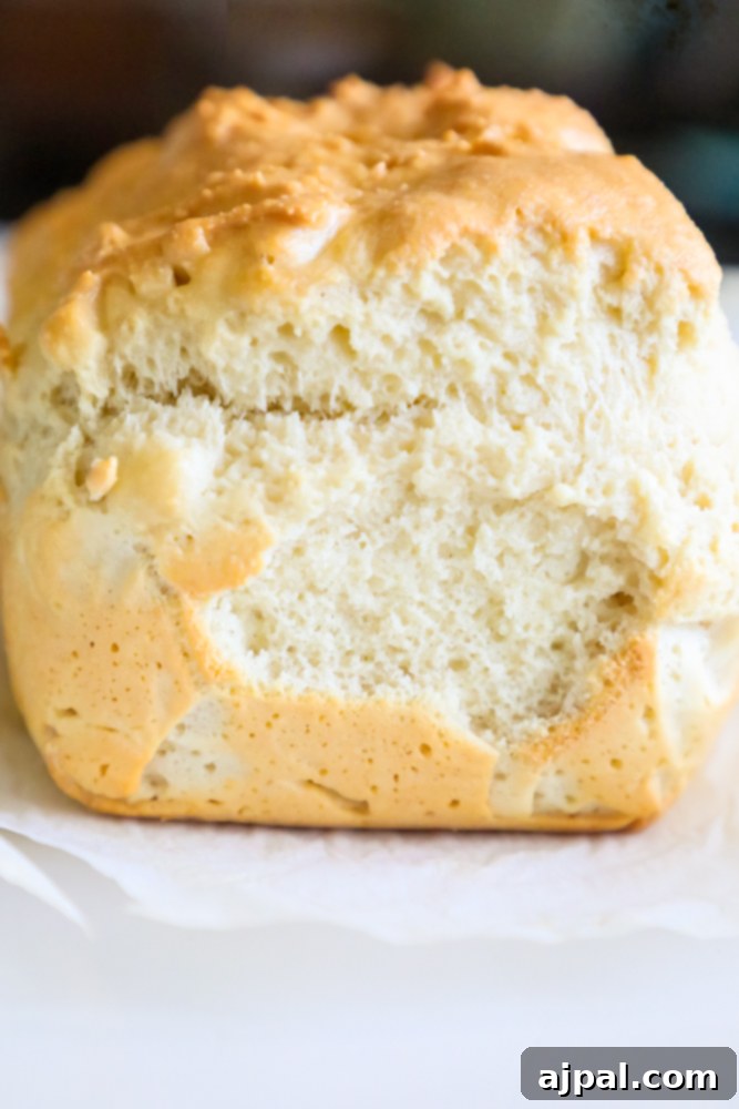 A close-up of Keto Bread Recipe dough in a mixing bowl, ready to be transferred to a loaf pan.