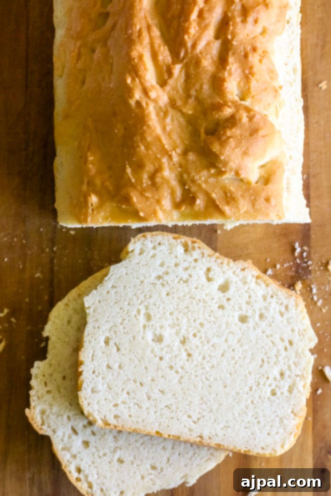 Easy low carb bread recipe on a wooden cutting board, with a perfectly golden crust.