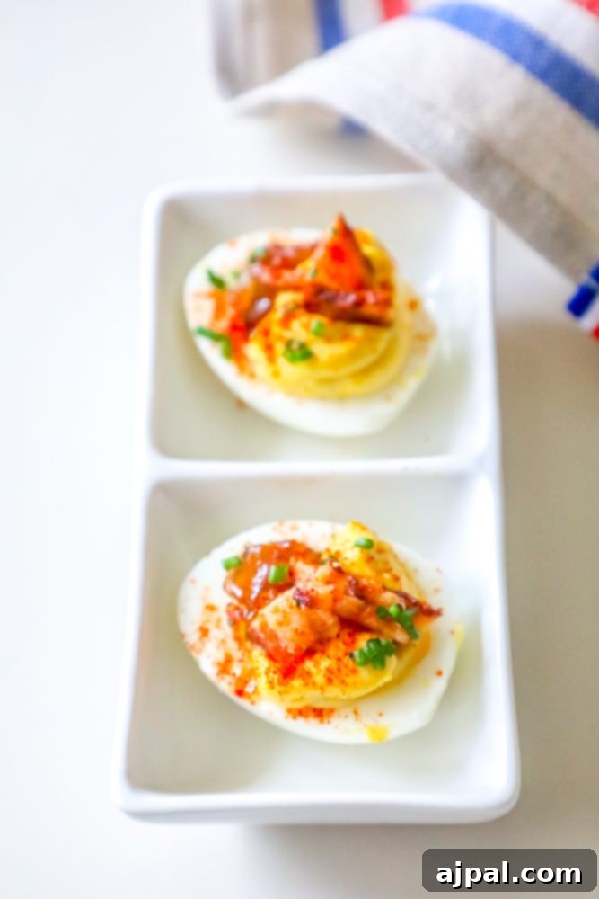 Deviled Delights with Bacon Onion Jam 5 A stunning spread of bacon and onion jam deviled eggs arranged artfully on a platter, showcasing their vibrant colors and gourmet appeal.