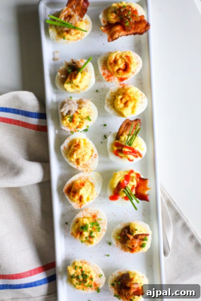 Seriously Delicious Deviled Eggs 5 A close-up of beautifully garnished deviled eggs on a white platter, ready to serve.