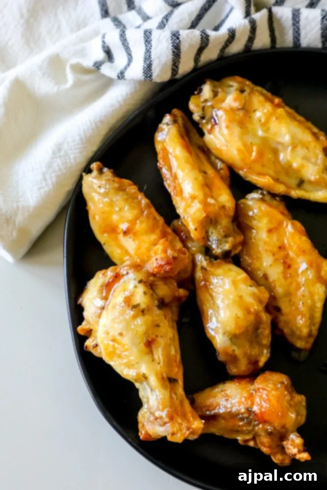 Crispy Ranch Baked Chicken Wings 2 ranch baked wings on a black plate