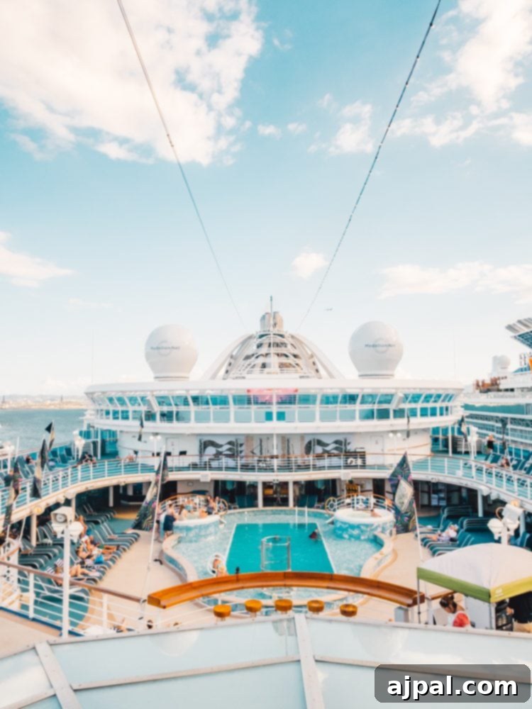 A serene view of a cruise ship pool, glistening under the sun, with a refreshing Pina Colada in the foreground, ready for a perfect day at sea.