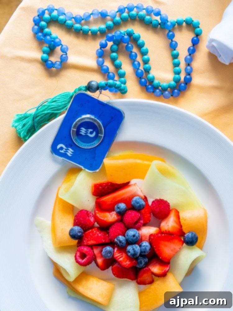 Gluten-Free Cruising on the Caribbean Princess 2 A plate of gluten free fruit with a blue tassel on it.
