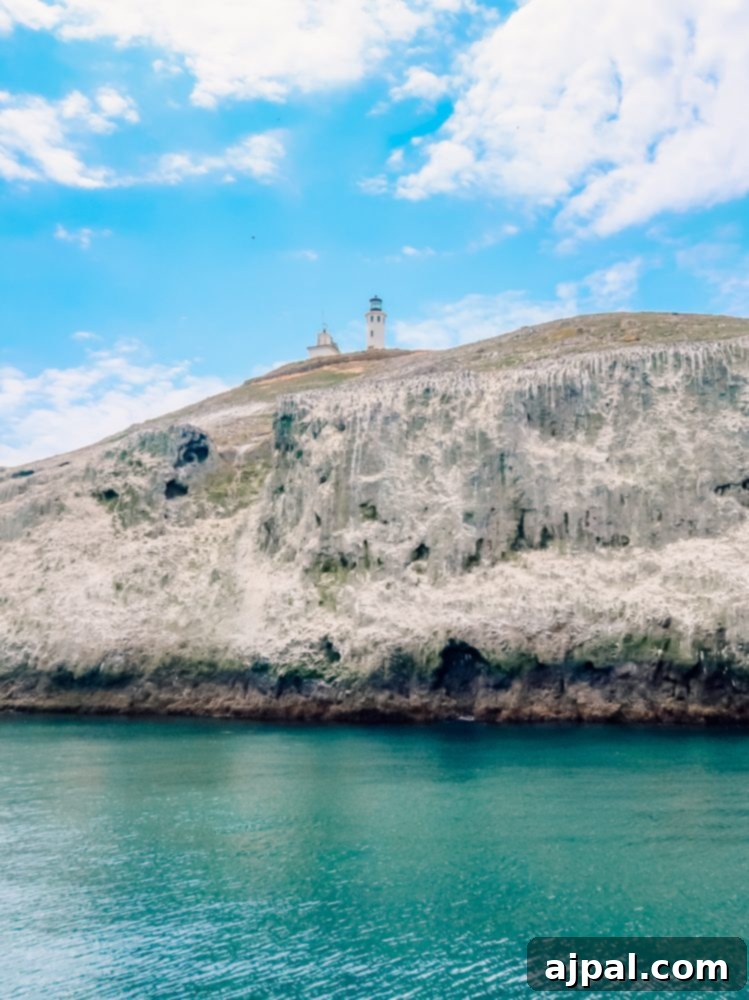 Golden State Wanderlust 4 Anacapa Island Lighthouse perched majestically on a cliff along a scenic California coast, ideal for a road trip