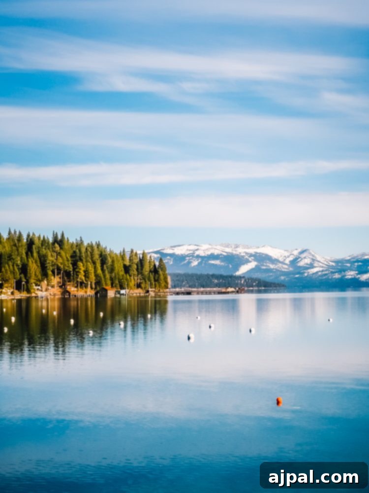 Golden State Wanderlust 10 A stunning view of Lake Tahoe in California, with its crystal-clear blue waters surrounded by lush green mountains, perfect for a scenic road trip.