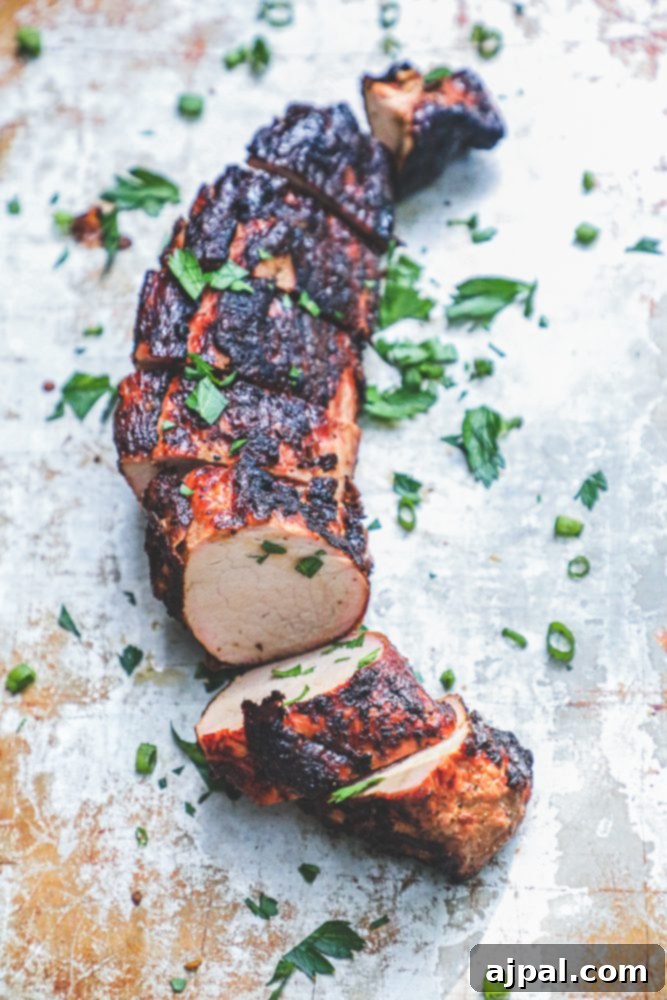 The Ultimate Grilled Pork Tenderloin 8 picture of a grilled pork tenderloin with cilantro on top