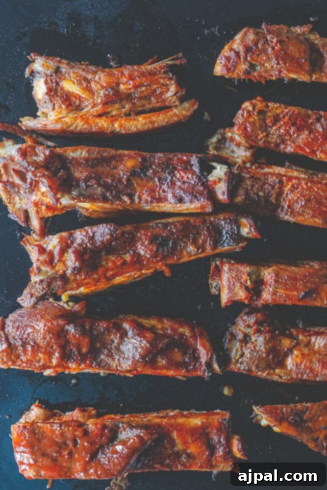 Another view of mouthwatering slow cooker ribs, demonstrating their rich color and succulent texture.