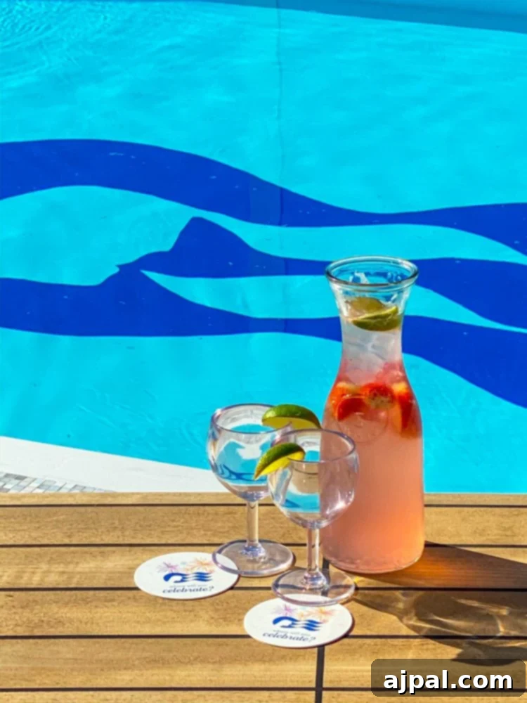 Sky Princess's Stellar Bar Hop 4 A refreshing pitcher of water sits on a table beside the lively Sky Princess Cruise Ship pool bar, capturing a moment of relaxation and enjoyment.