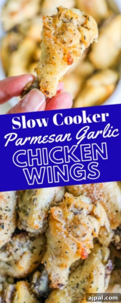 A stack of slow cooker garlic parmesan chicken wings, drizzled with sauce and ready to be served.