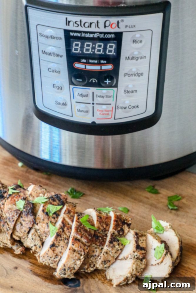 Ultimate Pressure Cooker Pork Tenderloin 8 Succulent Instant Pot Pork Tenderloin slices, perfectly browned and garnished, ready to be served.