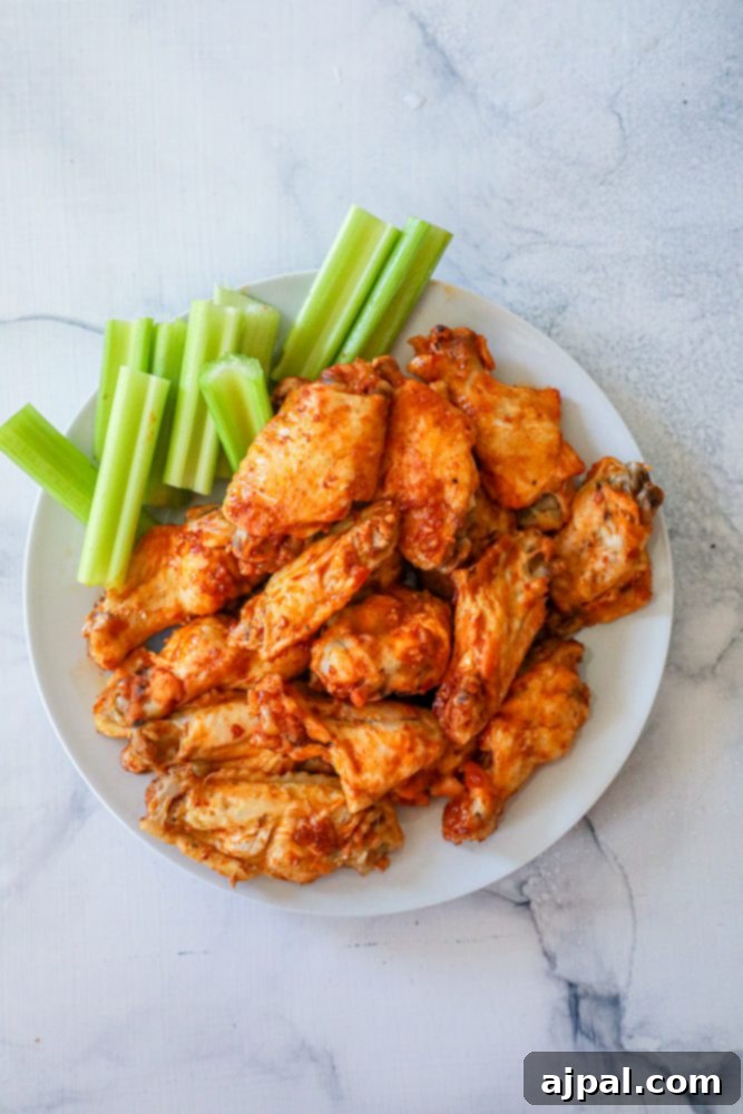 Ultimate Instant Pot Chicken Wings 2 Easy Instant Pot Buffalo Wings with celery sticks.