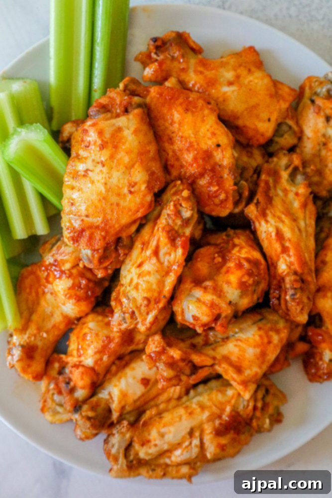 Ultimate Instant Pot Chicken Wings 3 Easy Keto Instant Pot Chicken Wings recipe served with celery sticks.