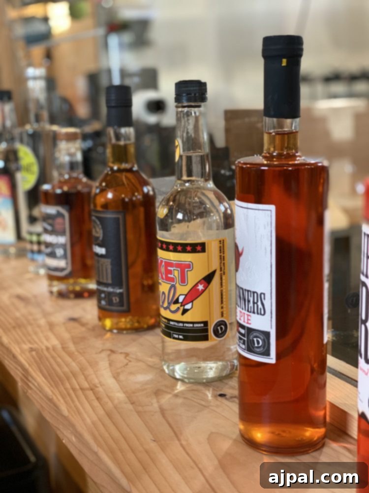 Iowa's Corn Belt: A Journey Through America's Farms 5 Several bottles of Corn Fed Iowa liquor are lined up on a counter.