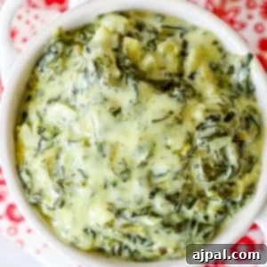 Spinach dip recipe in a white bowl.