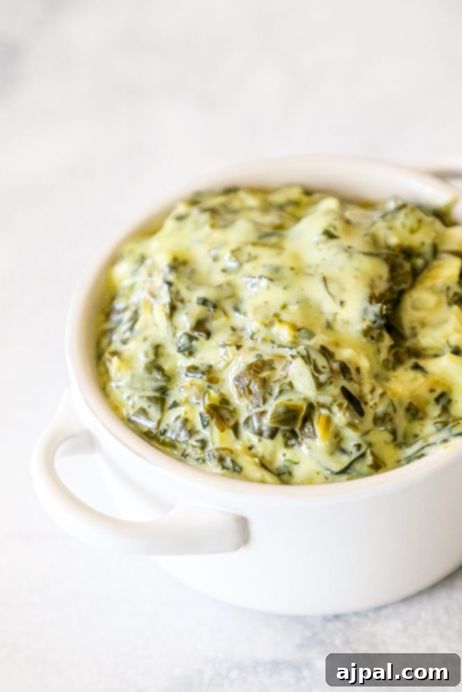 creamed green spinach in a white bowl