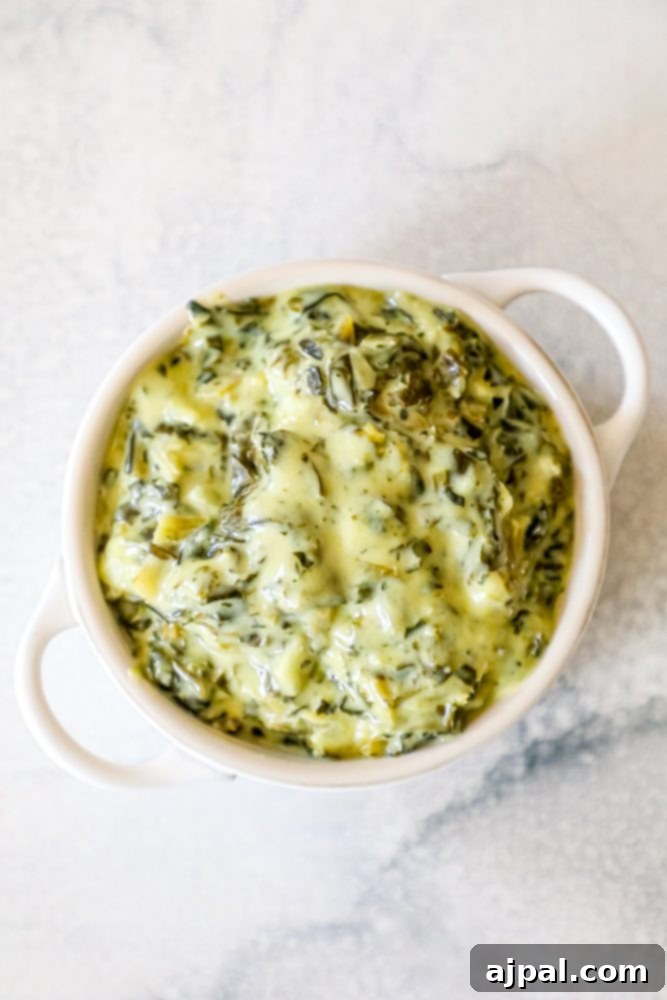 creamed green spinach in a white bowl