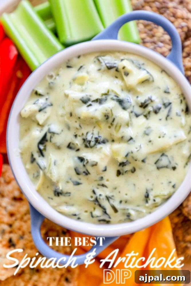 A close-up shot of the best keto spinach and artichoke dip recipe, showing its inviting golden-brown crust and creamy interior, ready to be served and enjoyed.